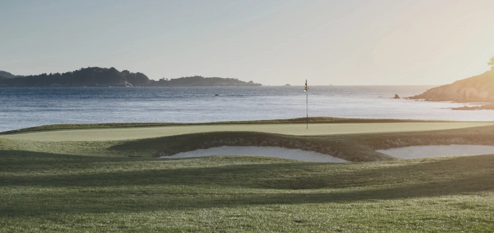 Golf course with ocean view and sunset